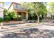 Charming two-story home with a cozy front porch, landscaped yard, and sidewalk appeal at 21014 W Ridge Rd, Buckeye, AZ 85396