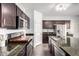 Well-equipped kitchen featuring dark cabinets, stainless appliances, and granite countertops at 21014 W Ridge Rd, Buckeye, AZ 85396