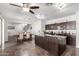 Open-concept kitchen with dark cabinetry, stainless appliances, and granite island flows into dining area at 21014 W Ridge Rd, Buckeye, AZ 85396