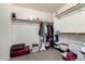 A walk-in closet featuring shelving, hanging rods, and carpeted floors at 21014 W Ridge Rd, Buckeye, AZ 85396