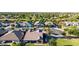 Aerial view of a residential neighborhood with well-maintained homes and green lawns in a suburban setting at 21022 E Arroyo Verde Ct, Queen Creek, AZ 85142