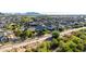 Scenic aerial view of the property nestled in a community with picturesque mountain views and lush greenery at 21022 E Arroyo Verde Ct, Queen Creek, AZ 85142