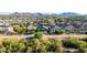 Beautiful aerial shot showcasing the home's location within a serene community and stunning mountain backdrop at 21022 E Arroyo Verde Ct, Queen Creek, AZ 85142
