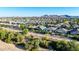 Spacious neighborhood with well-maintained homes and manicured lawns, offering a peaceful suburban living experience at 21022 E Arroyo Verde Ct, Queen Creek, AZ 85142