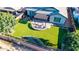 Stunning backyard showcasing artificial turf, a covered patio, and manicured garden beds at 21022 E Arroyo Verde Ct, Queen Creek, AZ 85142