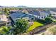 Secluded backyard featuring a covered patio, artificial turf, and lush landscaping for relaxation and privacy at 21022 E Arroyo Verde Ct, Queen Creek, AZ 85142