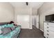 Bedroom featuring a ceiling fan, trundle bed, and plenty of closet space at 21022 E Arroyo Verde Ct, Queen Creek, AZ 85142