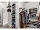Well-organized walk-in closet with shelving and hanging space for clothing and accessories at 21022 E Arroyo Verde Ct, Queen Creek, AZ 85142