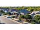 Inviting home boasts mature landscaping, covered porch, and an attached two-car garage at 21022 E Arroyo Verde Ct, Queen Creek, AZ 85142