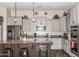 Kitchen showcasing granite countertops, pendant lighting, stainless steel appliances and white cabinets at 21022 E Arroyo Verde Ct, Queen Creek, AZ 85142