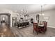 Wide open floorplan between kitchen with large island, stainless appliances, and dining area at 21022 E Arroyo Verde Ct, Queen Creek, AZ 85142
