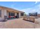 This backyard features a covered patio, outdoor kitchen, and trampoline for Gathering fun at 23886 W Harrison Dr, Buckeye, AZ 85326
