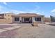 Spacious backyard with covered patio, grill, and ample space for outdoor activities at 23886 W Harrison Dr, Buckeye, AZ 85326