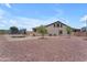 Large backyard features desert landscaping, privacy fence, and trampoline at 23886 W Harrison Dr, Buckeye, AZ 85326