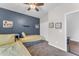 Bedroom featuring twin beds with storage and a large window for natural light at 23886 W Harrison Dr, Buckeye, AZ 85326