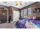 Inviting bedroom with a ceiling fan, lots of natural light, and ample closet space at 23886 W Harrison Dr, Buckeye, AZ 85326
