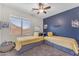 Comfortable bedroom offering two beds with drawers and a bright airy atmosphere at 23886 W Harrison Dr, Buckeye, AZ 85326