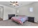 Bright bedroom with ceiling fan, neutral walls, and comfortable carpeting at 23886 W Harrison Dr, Buckeye, AZ 85326