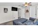 Bonus room with comfortable seating, a mounted TV, and neutral wall color at 23886 W Harrison Dr, Buckeye, AZ 85326