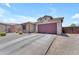Charming single-Gathering home featuring stone accents, a spacious two-car garage, and low-maintenance desert landscaping at 23886 W Harrison Dr, Buckeye, AZ 85326