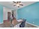 Home office with modern desk, view of the entryway, and neutral carpet at 23886 W Harrison Dr, Buckeye, AZ 85326