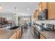 Well-equipped kitchen featuring stainless steel appliances, granite countertops, and plenty of storage space at 23886 W Harrison Dr, Buckeye, AZ 85326