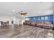 Open floor plan showcasing a large living room with an entertainment area at 23886 W Harrison Dr, Buckeye, AZ 85326