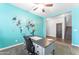 Bright office space featuring modern world map decor with a desk, chair, and natural light at 23886 W Harrison Dr, Buckeye, AZ 85326