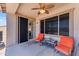 Relaxing covered patio with ceiling fan, comfortable seating, and sliding glass door at 23886 W Harrison Dr, Buckeye, AZ 85326