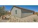 View of the back of this well-kept home and low-water landscaping at 25038 N 174Th Ln, Surprise, AZ 85387