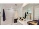 Bright bathroom features a walk-in shower, neutral finishes, and a mirrored vanity at 25038 N 174Th Ln, Surprise, AZ 85387