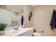 Stylish bathroom featuring modern fixtures, a large mirror, and a sleek vanity with ample counter space at 25038 N 174Th Ln, Surprise, AZ 85387