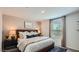 Comfortable bedroom with a neutral color palette, plush bedding, and modern décor at 25038 N 174Th Ln, Surprise, AZ 85387