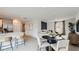Open-concept living room and kitchen area with modern decor, stainless steel appliances and ample space for entertaining at 25038 N 174Th Ln, Surprise, AZ 85387