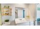 Bright bathroom with white vanity, large mirror, and neutral accents, offering a clean and modern design at 25082 N 174Th Ln, Surprise, AZ 85387