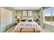 Inviting bedroom with neutral green walls, natural light, and comfortable furnishings, for a relaxing retreat at 25082 N 174Th Ln, Surprise, AZ 85387