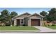 Charming single-story home with a two-car garage, well-manicured lawn, and desert landscaping at 25082 N 174Th Ln, Surprise, AZ 85387
