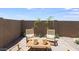Charming patio area with seating, decorative greenery and neutral color scheme at 25082 N 174Th Ln, Surprise, AZ 85387