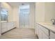 Expansive bathroom featuring double sink vanities and glass-enclosed shower at 25162 N 177Th Dr, Surprise, AZ 85387