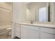 Well-lit bathroom features an extended vanity area, large mirror, and shower-tub combo at 25162 N 177Th Dr, Surprise, AZ 85387