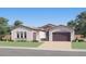 Inviting single-story home with arched windows, a paver driveway, and a 2-car garage providing great curb appeal at 25162 N 177Th Dr, Surprise, AZ 85387