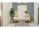 Stylized home office with custom desk, modern decor, and a neutral color palette at 25162 N 177Th Dr, Surprise, AZ 85387