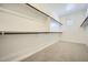 Large walk-in closet with built-in shelving and rods for optimal storage at 25162 N 177Th Dr, Surprise, AZ 85387