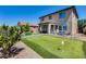 Spacious backyard with a putting green, comfortable seating area, and a serene outdoor setting at 2531 W Saint Catherine Ave, Phoenix, AZ 85041