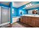 Bright bathroom with dual sink vanity, soaking tub, and walk-in shower at 2531 W Saint Catherine Ave, Phoenix, AZ 85041