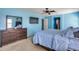 Bedroom with carpet, dresser and tv, and bright blue paint at 2531 W Saint Catherine Ave, Phoenix, AZ 85041