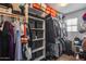 Walk-in closet with shelving, hanging racks, and ample storage space at 2531 W Saint Catherine Ave, Phoenix, AZ 85041