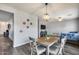 Dining area with modern light fixture and ample seating at 2531 W Saint Catherine Ave, Phoenix, AZ 85041
