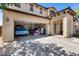 Spacious two car garage with ample storage space and a blue classic car at 2531 W Saint Catherine Ave, Phoenix, AZ 85041