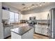 Well-lit kitchen with island and stainless steel appliances at 2531 W Saint Catherine Ave, Phoenix, AZ 85041